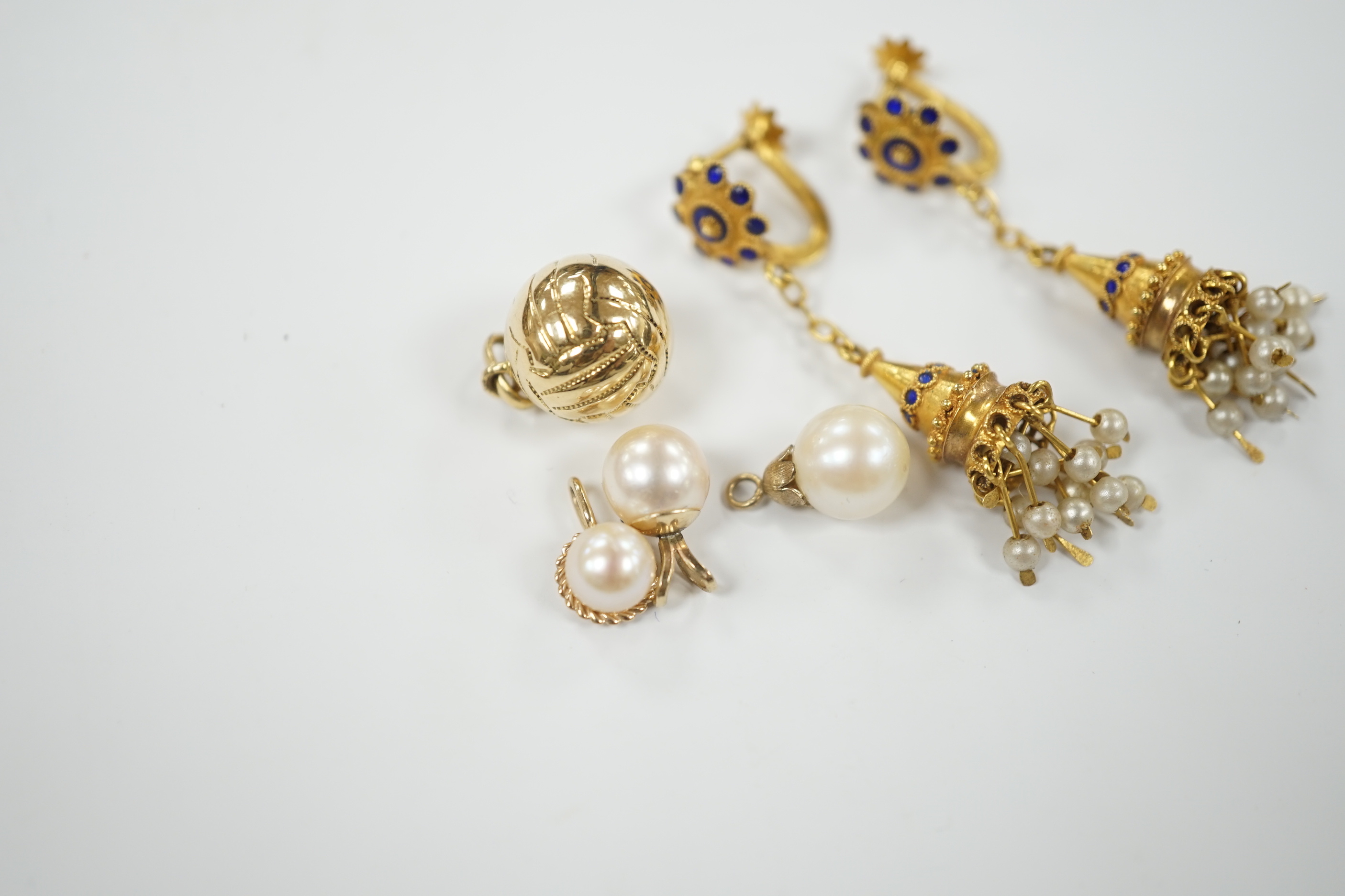 A pair of 585 tassel drop ear clips, 42mm, a yellow metal ball charm and three cultured pearl set pendants.